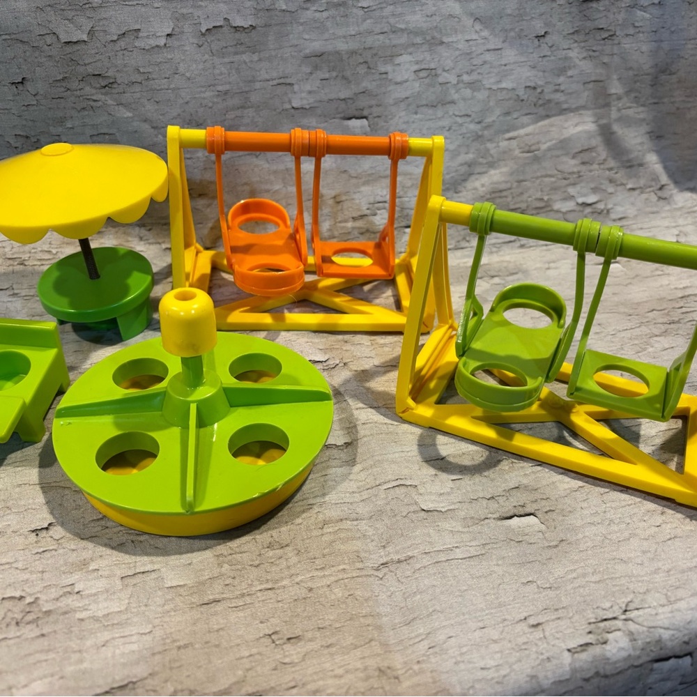 Vintage Fisher Price Little People swing set, merry go round table